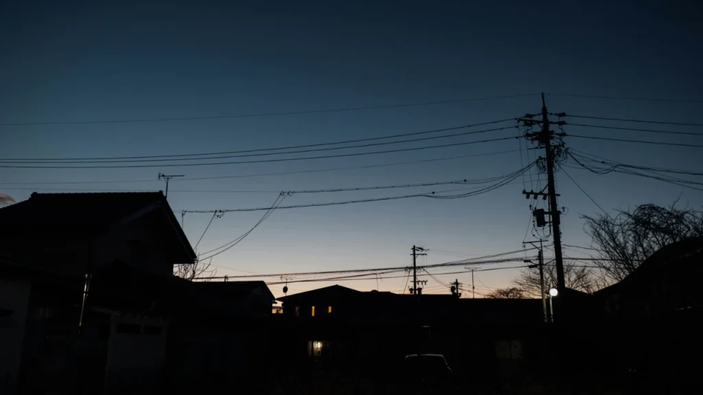 Surviving a Power Outage Winter power outage at night showing darkened neighborhood skyline - upper-intermediate ESL lesson plan about blackout survival preparedness