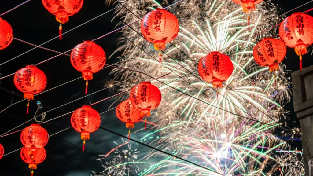 Chinese New Year Chinese New Year lanterns and fireworks celebration with traditional red decorations lighting up the night sky during festival