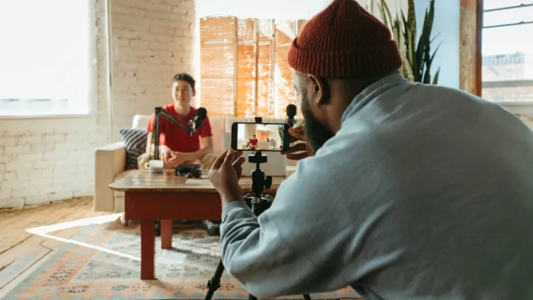 Content creator filming a video interview, used in a C1 lesson plan about income stacking and vlogging.